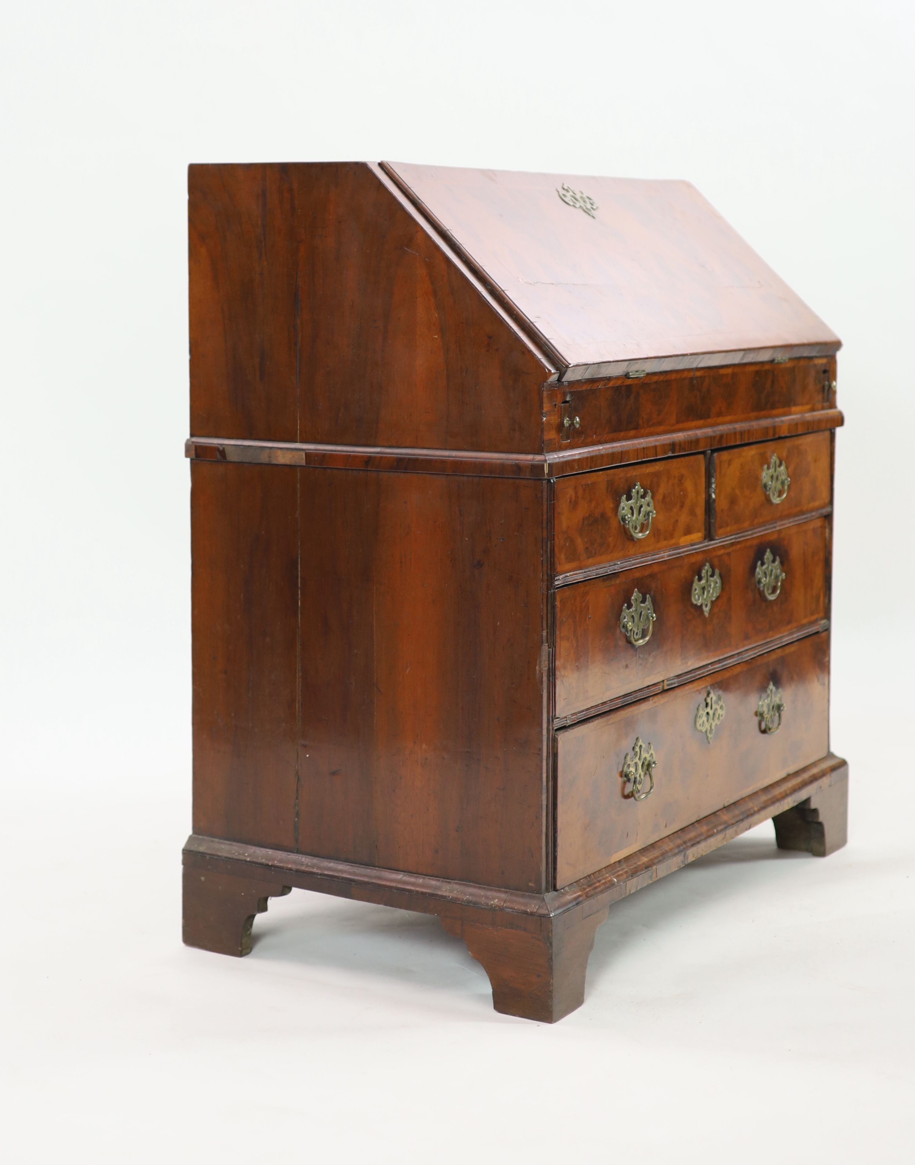 A George I walnut bureau, W.94cm D.52cm H.99cm